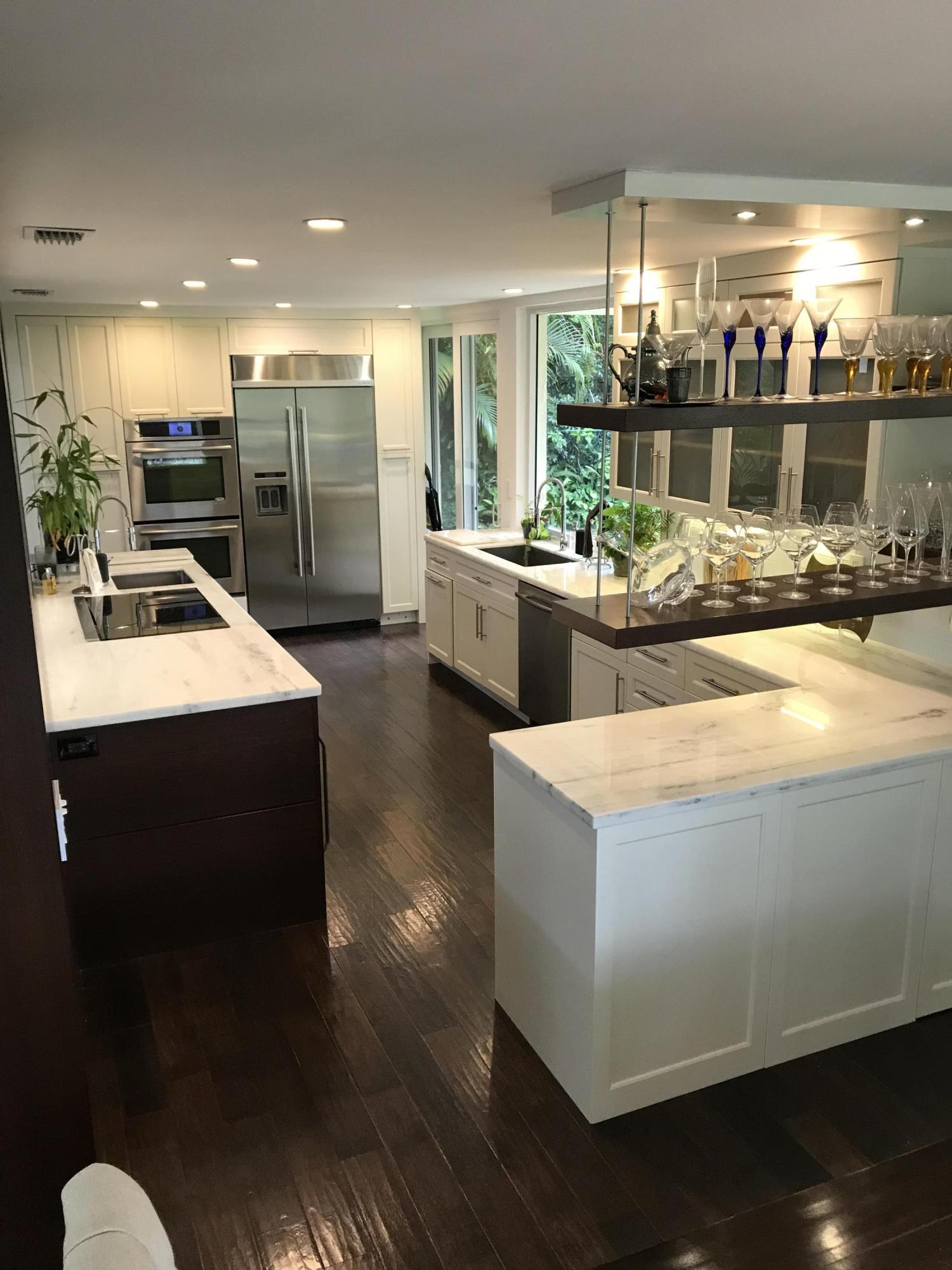 20981 Verano Way Boca Raton, FL 33433 - Photo 6 of 20 a kitchen with sink and view of living room