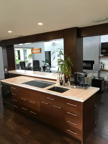 a bathroom with a sink double vanity and a mirror