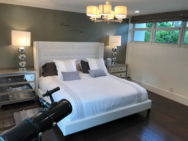 a bedroom with a bed and dresser