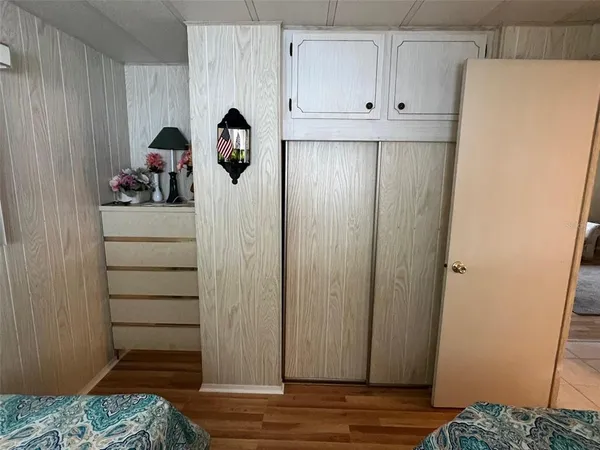 a view of hallway with wooden floor