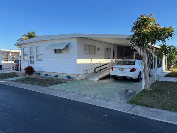 a front view of house with outdoor space and parking