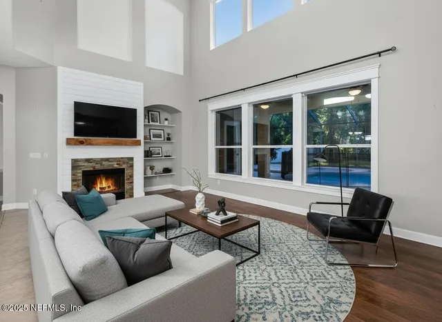 a living room with furniture and a fireplace