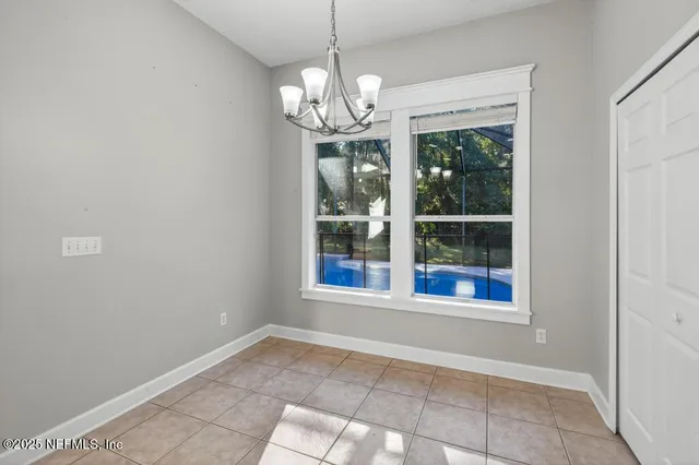 a view of an empty room with windows