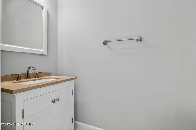 a view of a bathroom with a sink and vanity