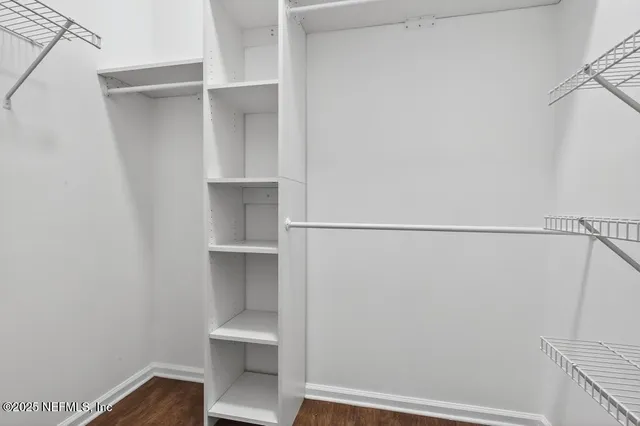 a view of an empty walk in closet
