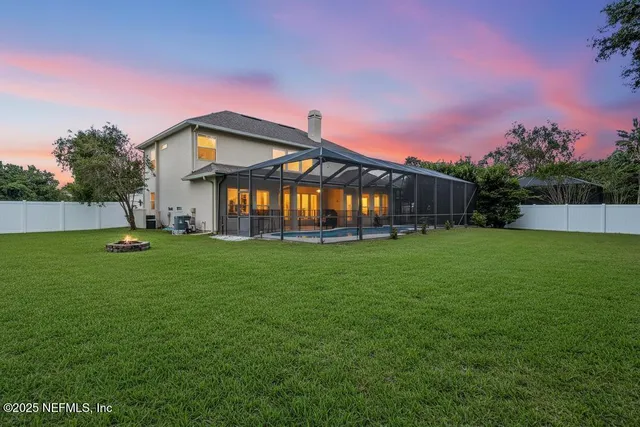 a front view of house with yard and outdoor seating