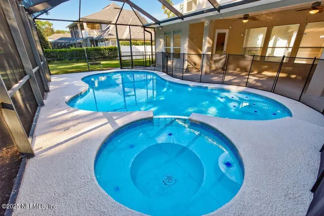 a view of a swimming pool with an outdoor seating
