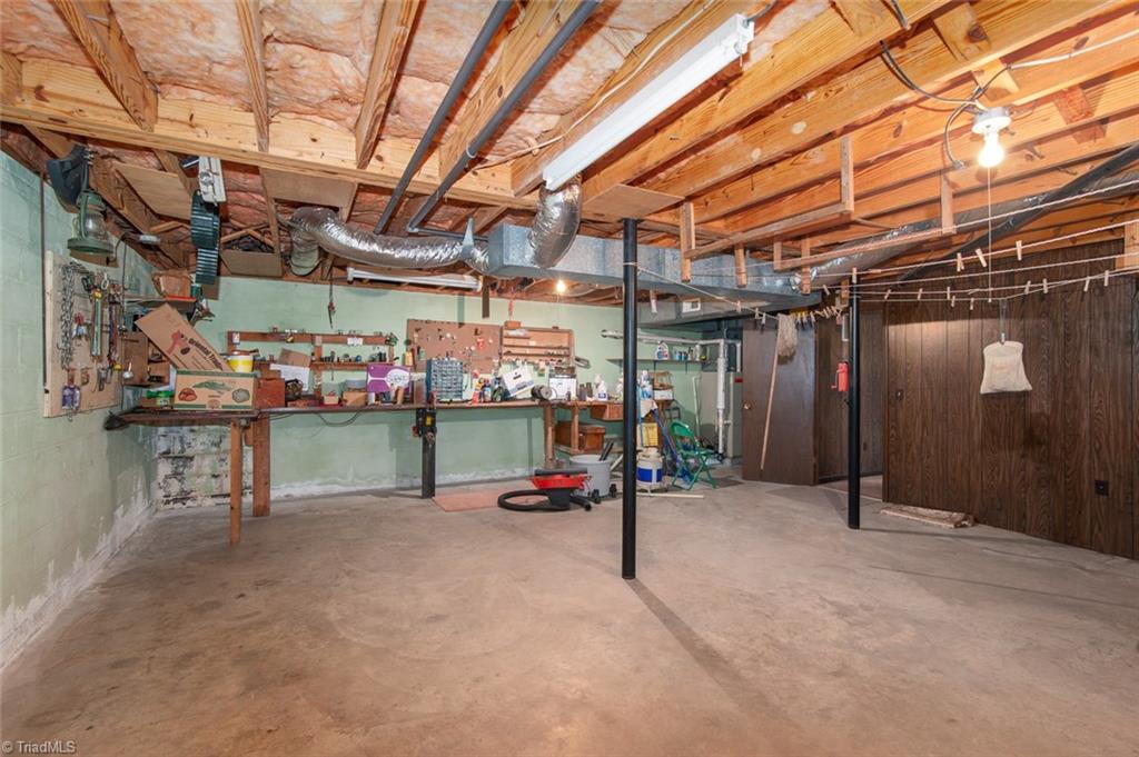 2305 Dover Place High Point, NC 27265 - Photo 17 of 20 Amazing Workshop area in basement with door leading to outside