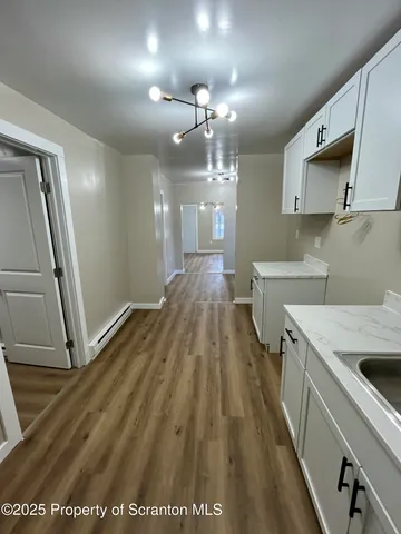 a view of a kitchen with a sink and dishwasher
