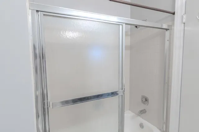 a view of a house with a yard and a garage