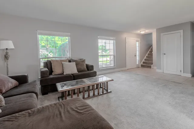a living room with furniture and windows