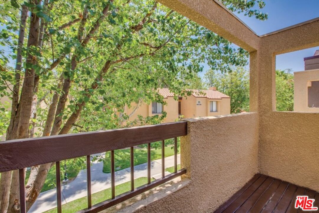 a view of a balcony with an outdoor space