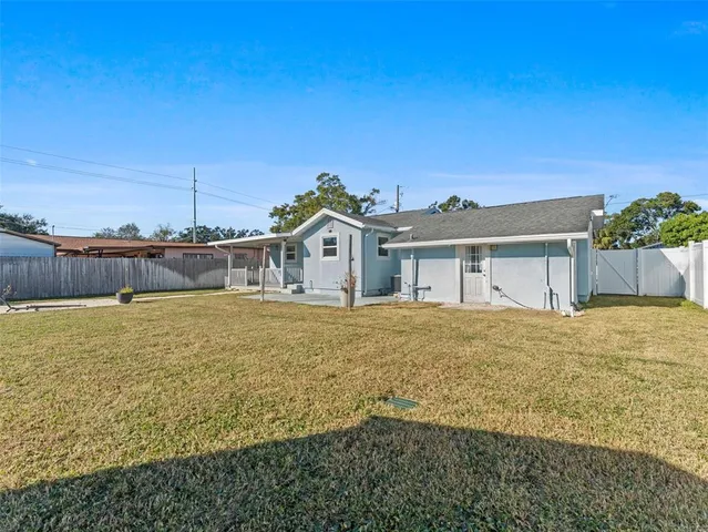 a view of a big yard with table and chair
