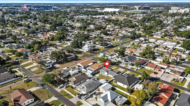 an aerial view of residential houses with city view