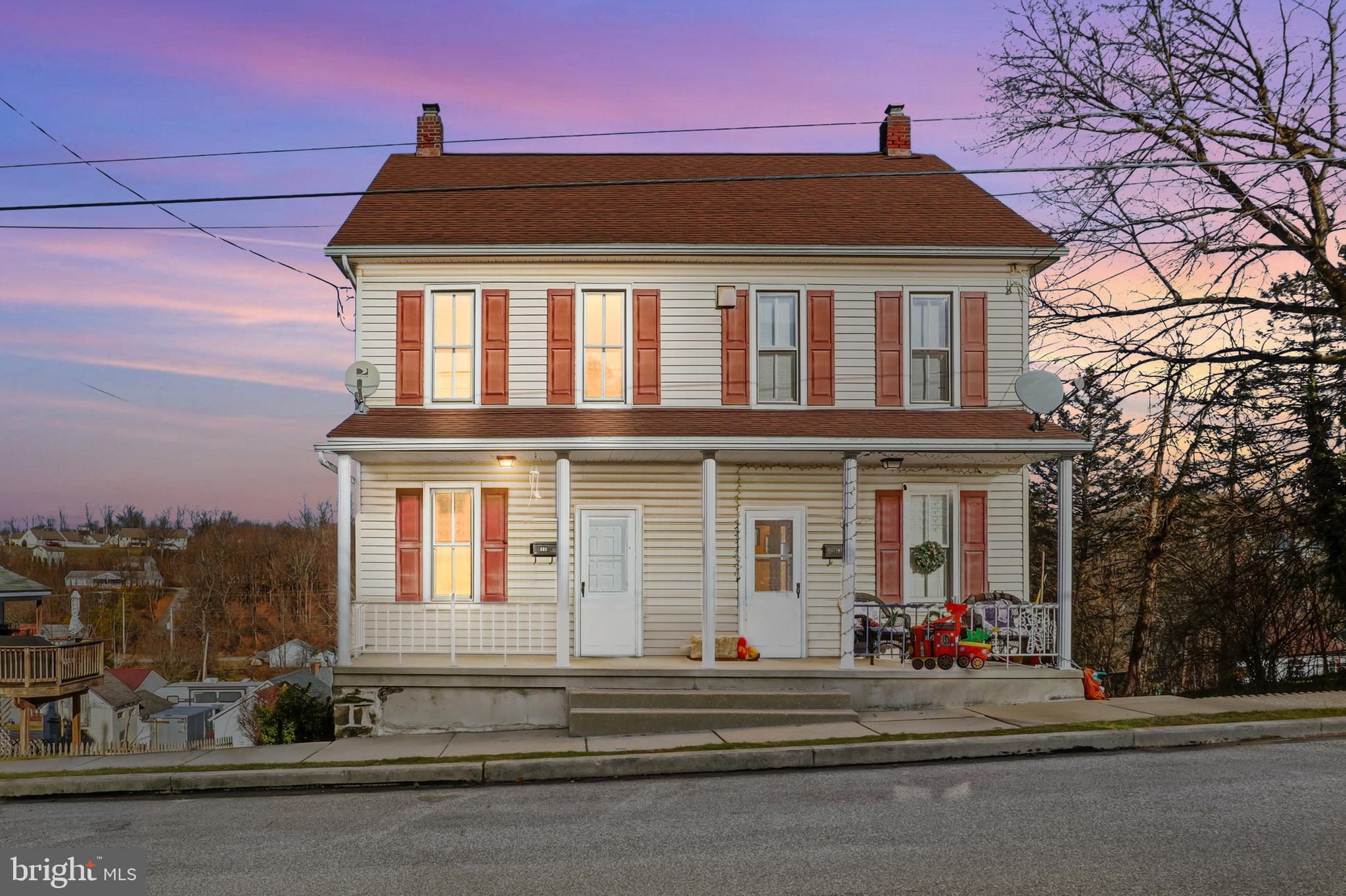 143 West Broad Street Yoe, PA 17313 - Photo 1 of 47 a front view of a house with a yard