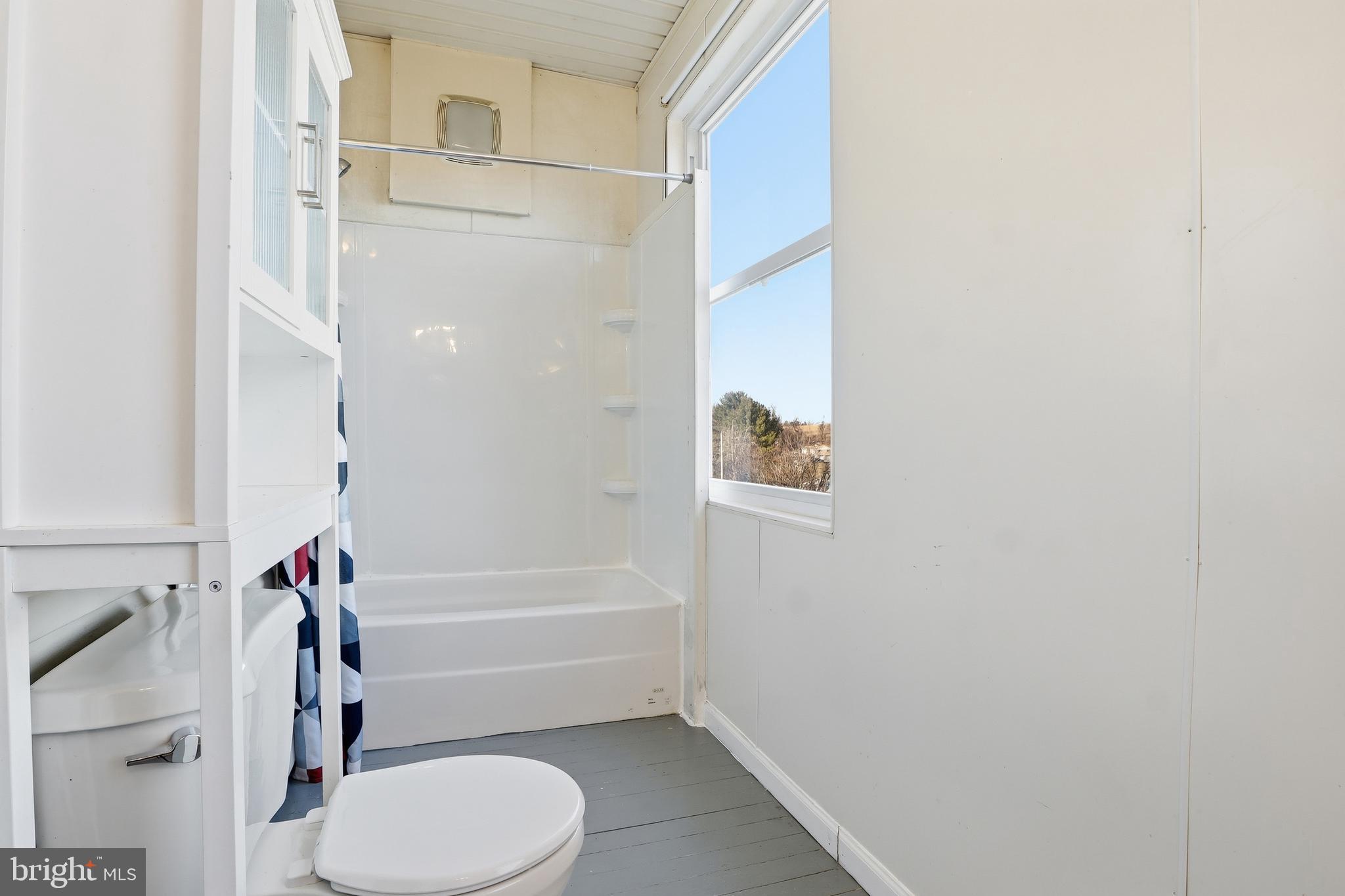 143 West Broad Street Yoe, PA 17313 - Photo 11 of 47 a bathroom with a toilet and a shower