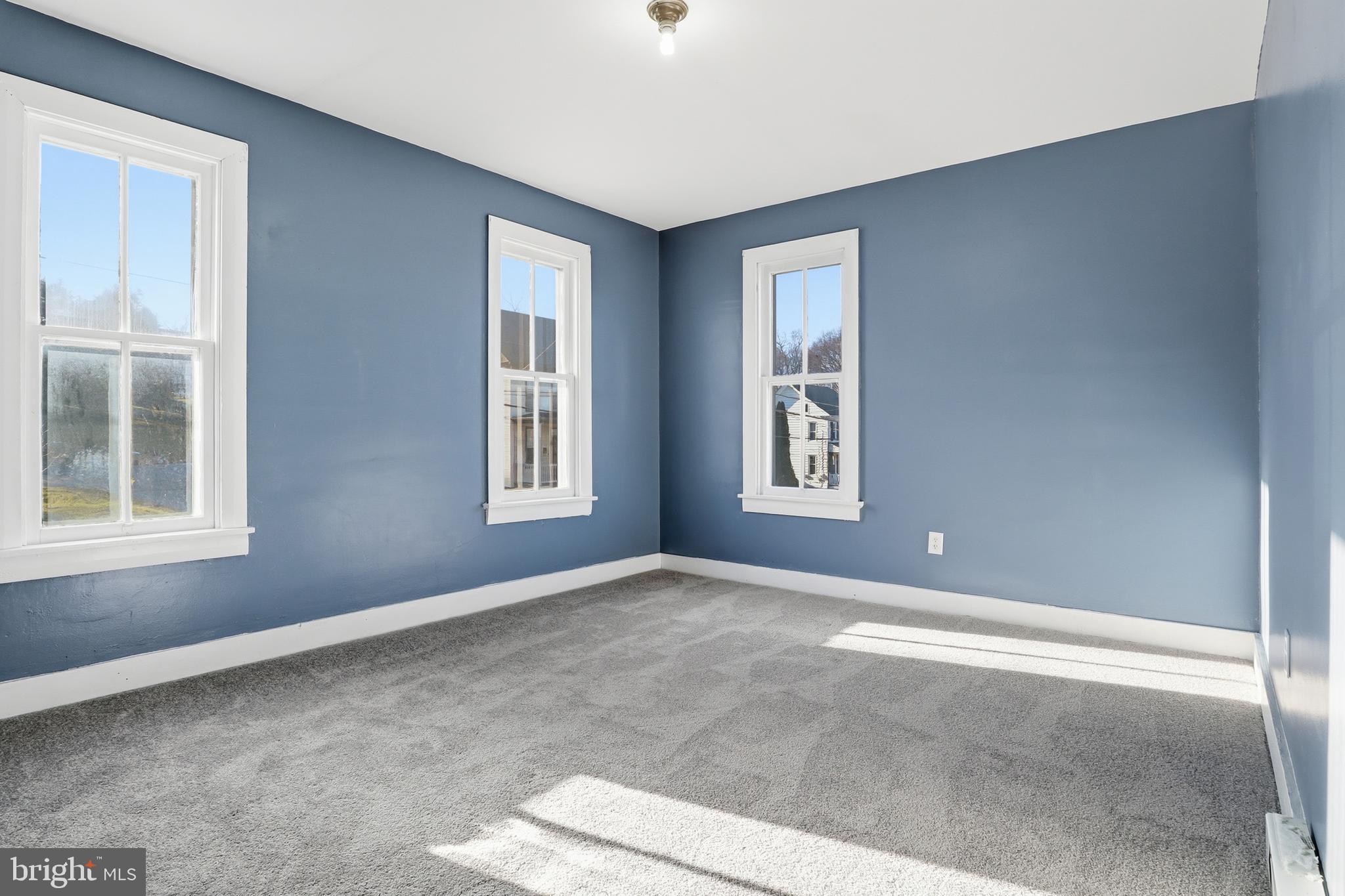 143 West Broad Street Yoe, PA 17313 - Photo 14 of 47 a view of an empty room with windows