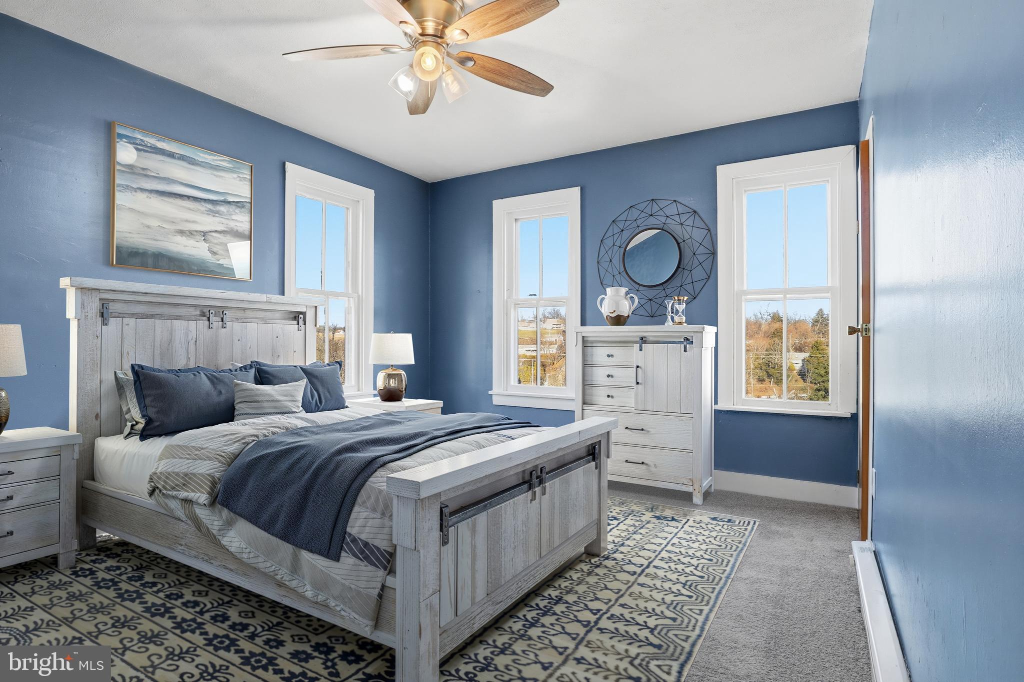 143 West Broad Street Yoe, PA 17313 - Photo 16 of 47 a bedroom with a bed and a chandelier