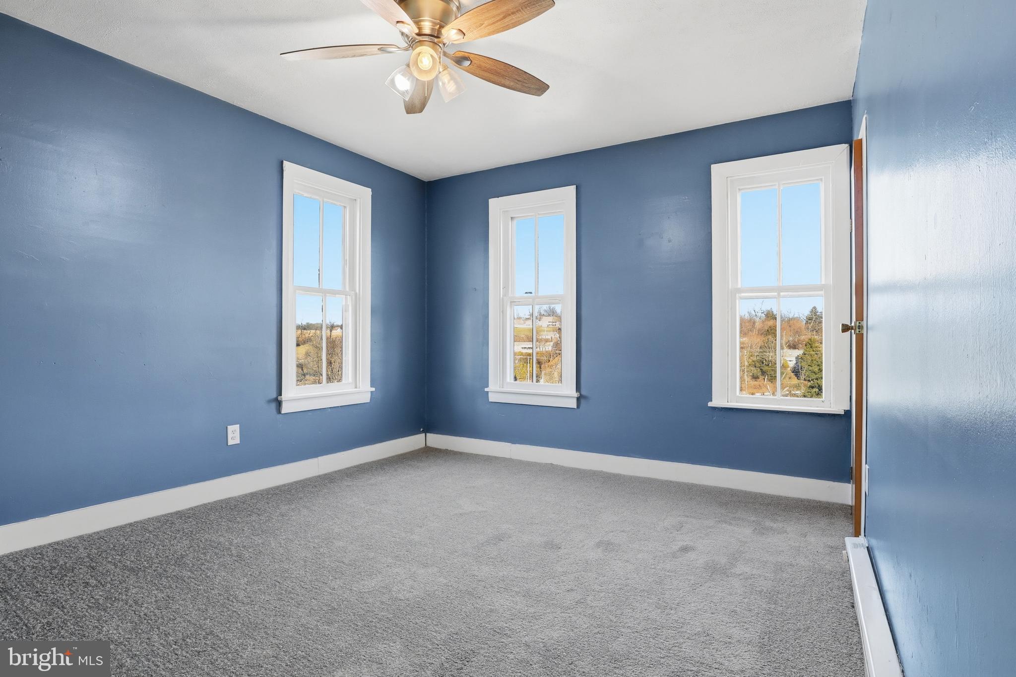 143 West Broad Street Yoe, PA 17313 - Photo 17 of 47 a view of an empty room with chandelier fan and fire place