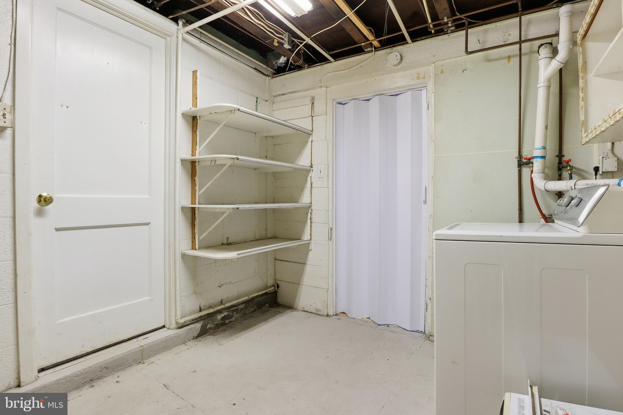 143 West Broad Street Yoe, PA 17313 - Photo 22 of 47 a view of storage and utility room with a washer and dryer