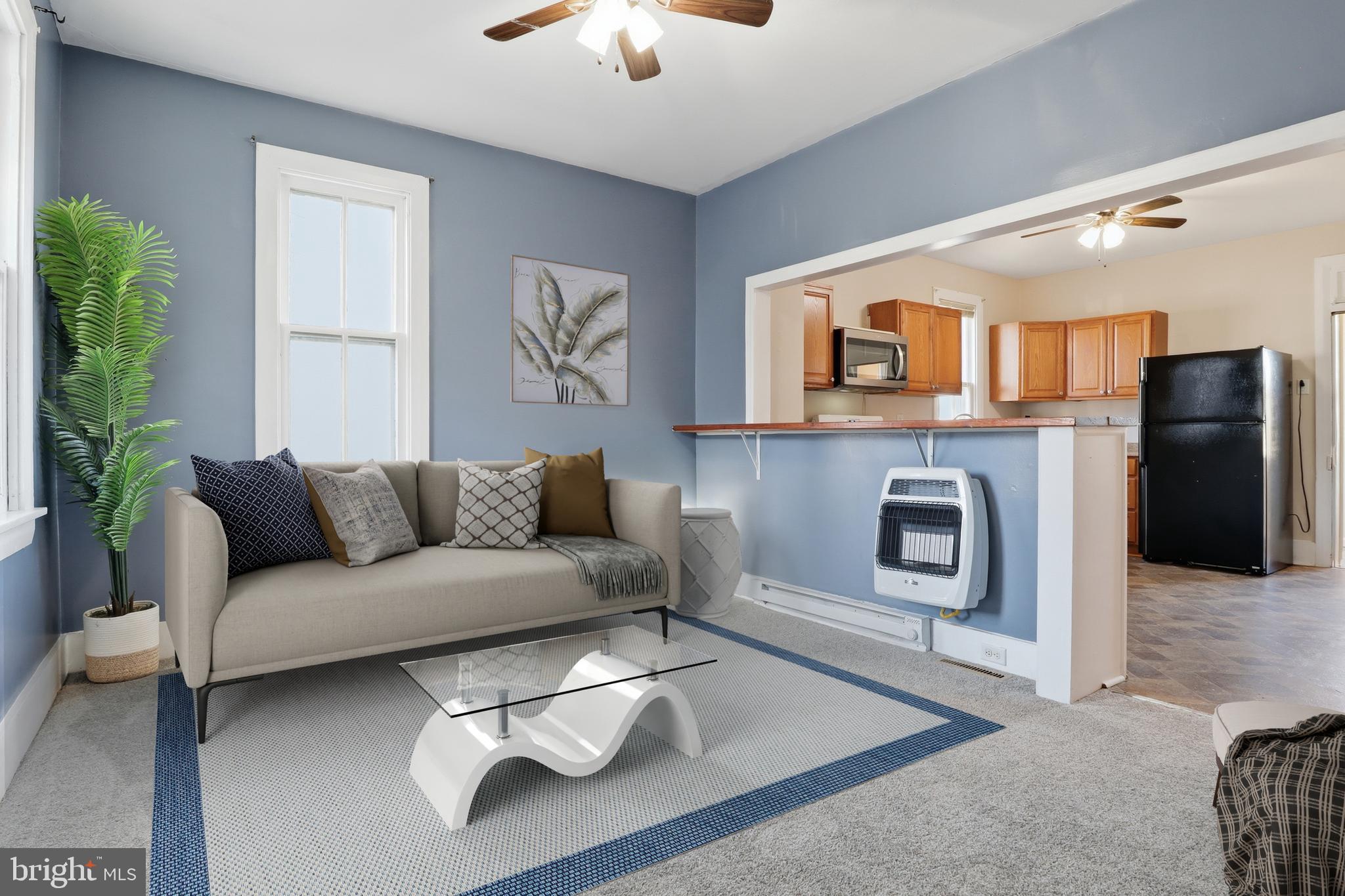 143 West Broad Street Yoe, PA 17313 - Photo 4 of 47 a living room with furniture and a fireplace