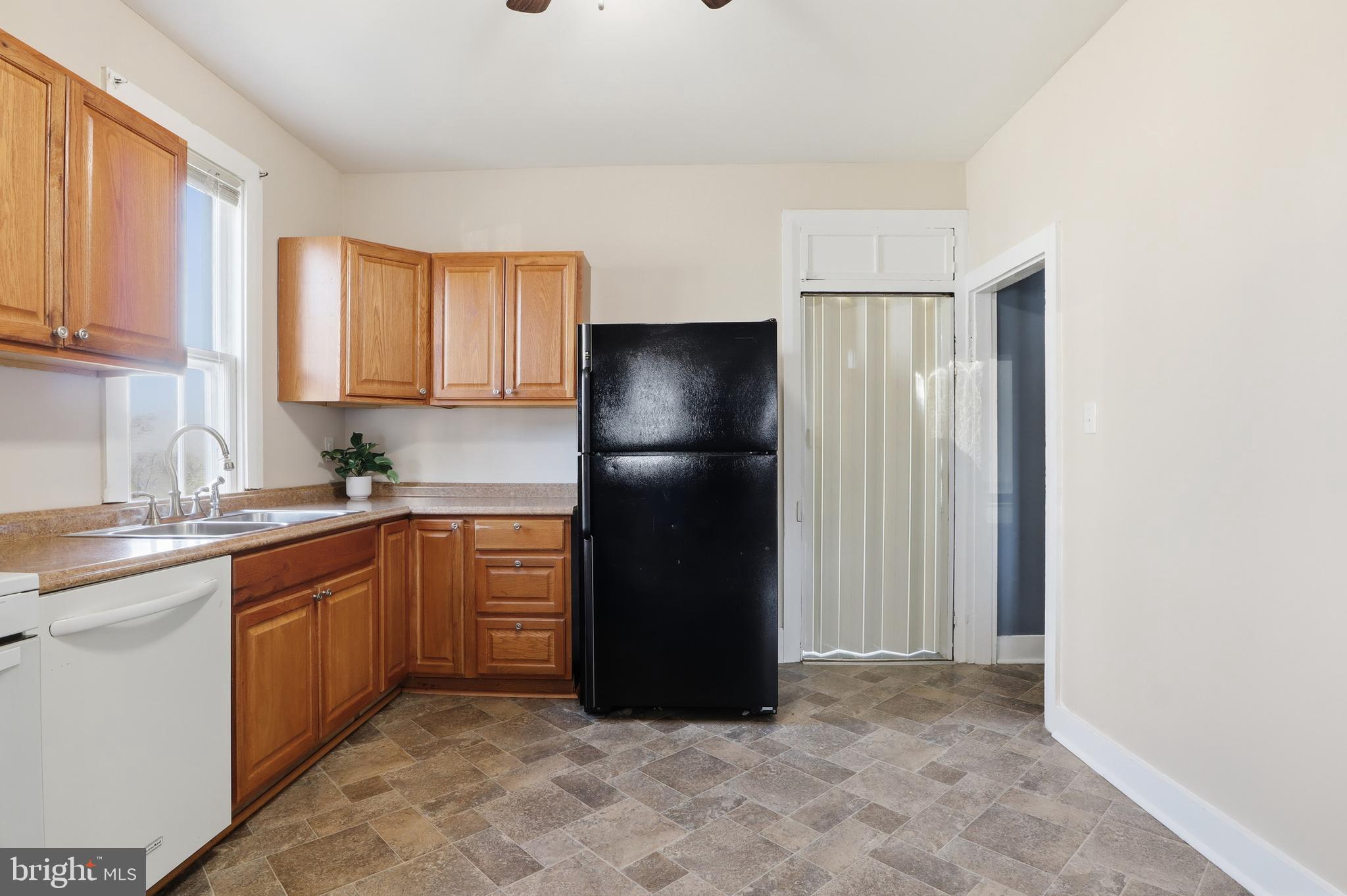 143 West Broad Street Yoe, PA 17313 - Photo 10 of 47 a kitchen with a refrigerator and a sink