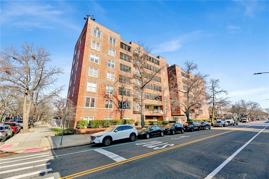 2711 Avenue X, Unit 6C Brooklyn, NY 11235 - Photo 1 of 23 a city street lined with buildings and cars
