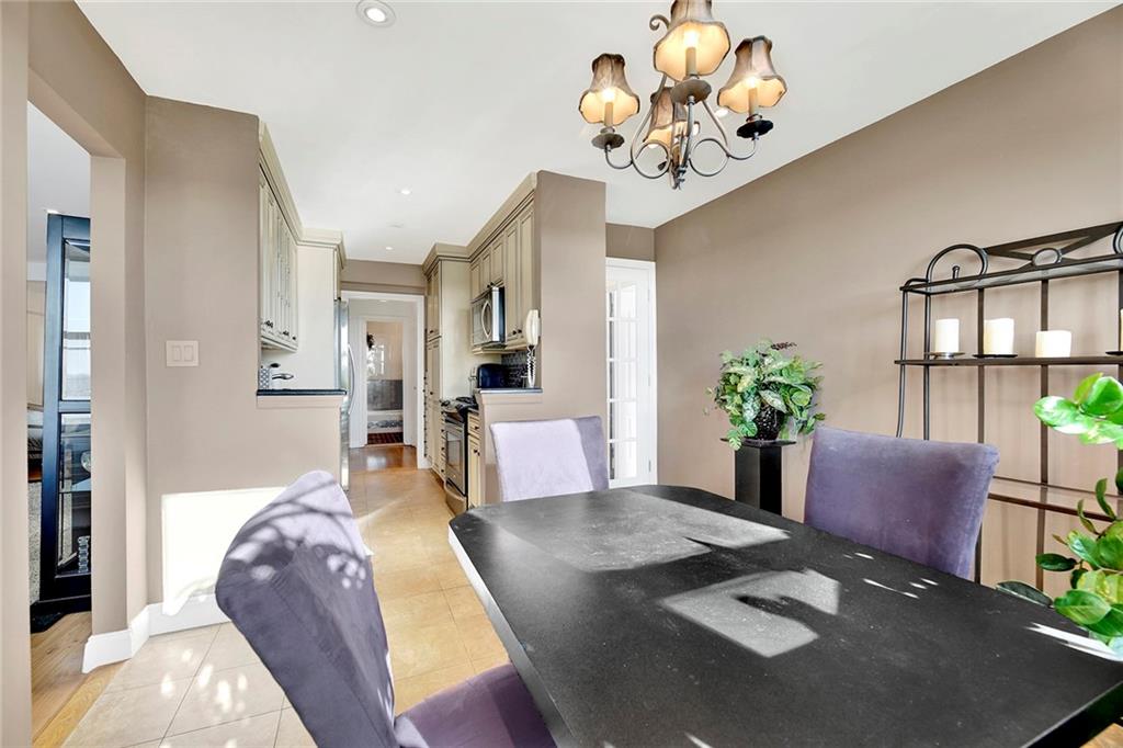 2711 Avenue X, Unit 6C Brooklyn, NY 11235 - Photo 12 of 23 a living room with furniture flowerpot and wooden floor