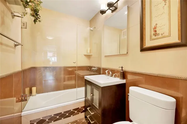a bathroom with a sink and mirror