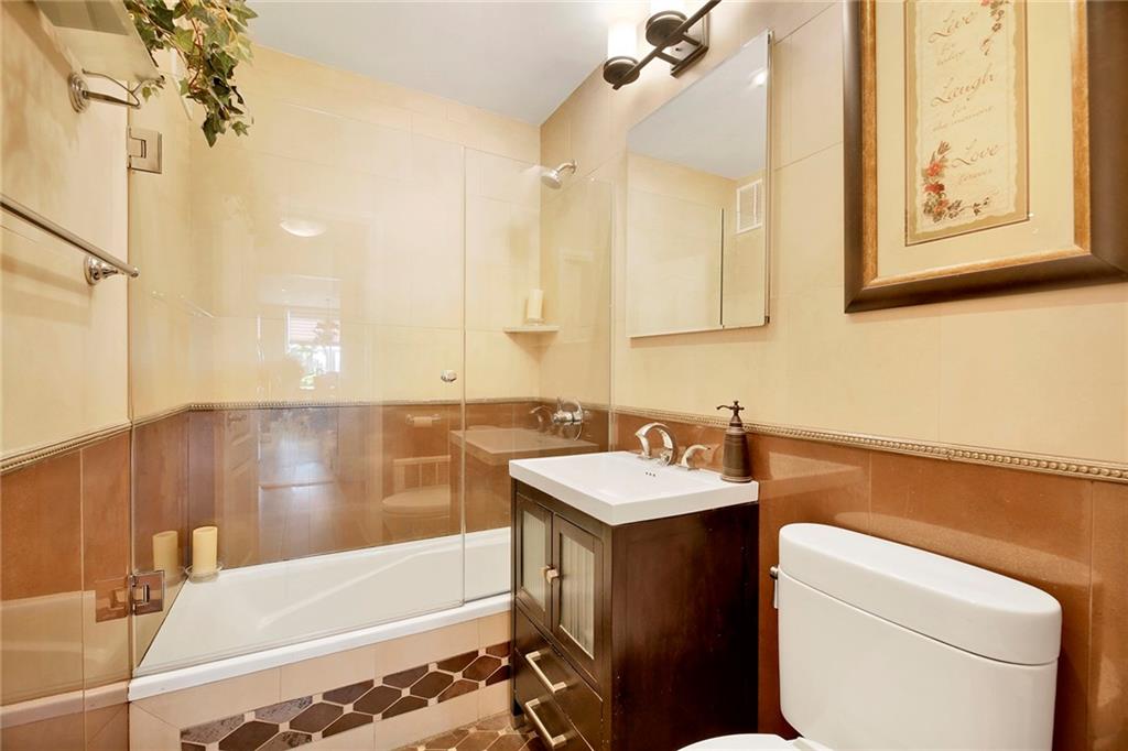 2711 Avenue X, Unit 6C Brooklyn, NY 11235 - Photo 18 of 23 a bathroom with a sink and a bathtub
