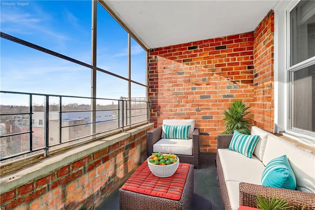 2711 Avenue X, Unit 6C Brooklyn, NY 11235 - Photo 20 of 23 a living room with furniture and a wooden floor