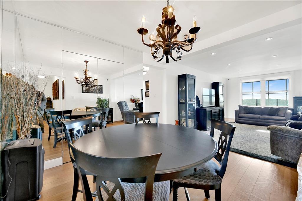2711 Avenue X, Unit 6C Brooklyn, NY 11235 - Photo 4 of 23 a view of a dining room with furniture and wooden floor