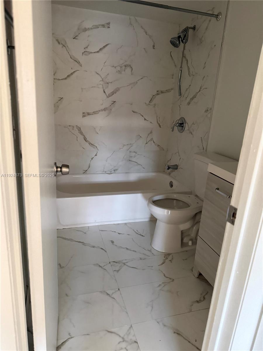 13215 Southwest 57th Terrace, Unit 206 Miami, FL 33183 - Photo 19 of 27 a bathroom with a sink toilet and shower