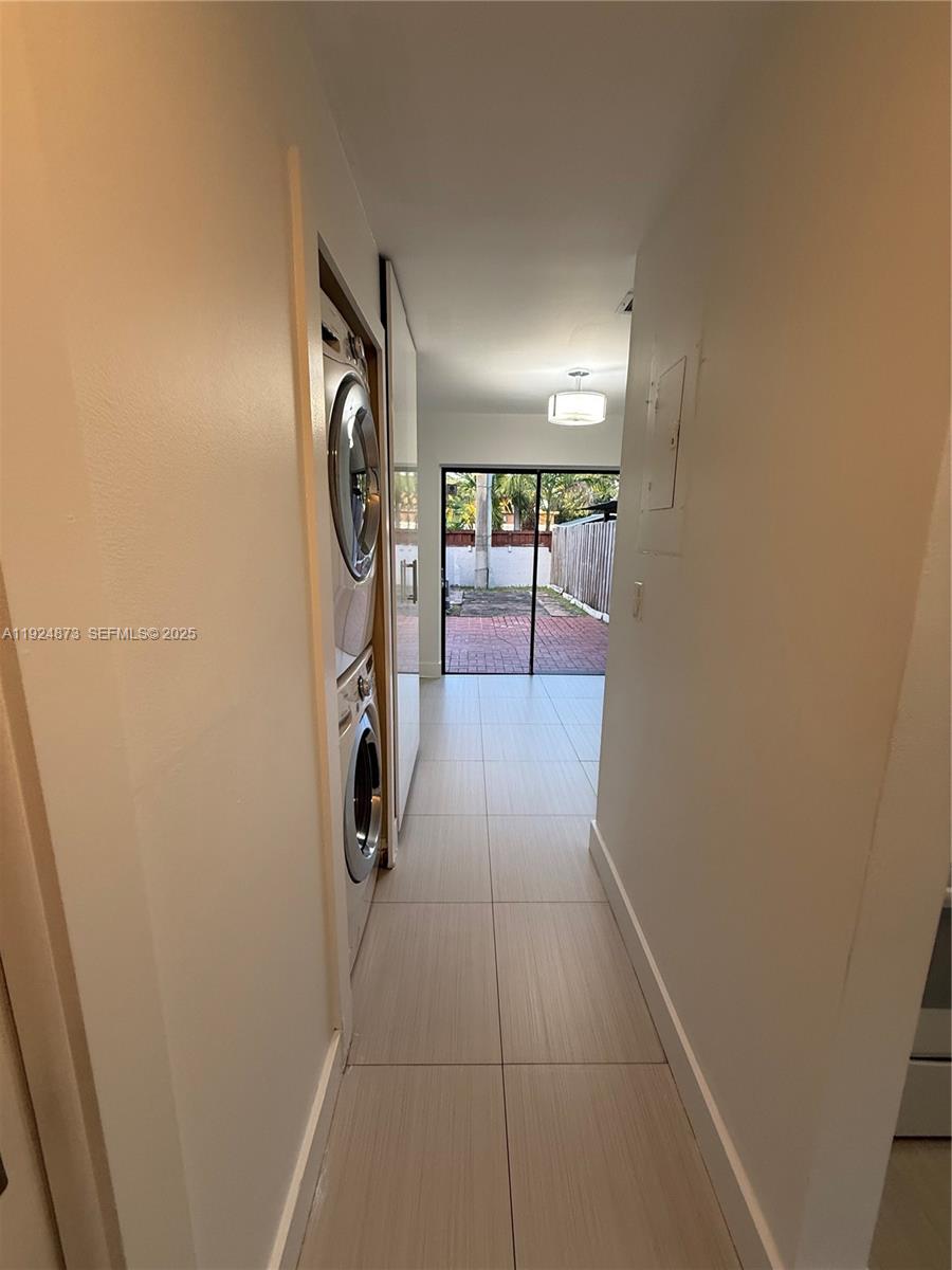 13215 Southwest 57th Terrace, Unit 206 Miami, FL 33183 - Photo 25 of 27 a view of hallway with washer and dryer