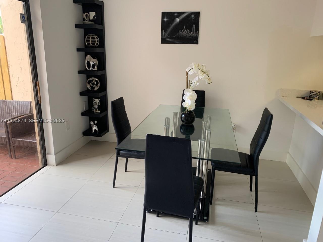 13215 Southwest 57th Terrace, Unit 206 Miami, FL 33183 - Photo 5 of 27 a view of a workspace with furniture and wooden floor