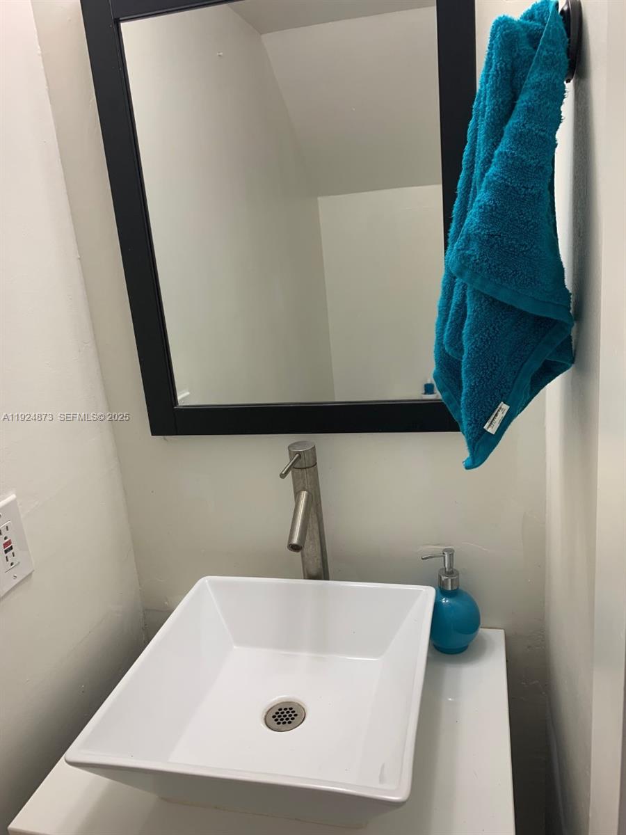 13215 Southwest 57th Terrace, Unit 206 Miami, FL 33183 - Photo 8 of 27 a bathroom with a white tub