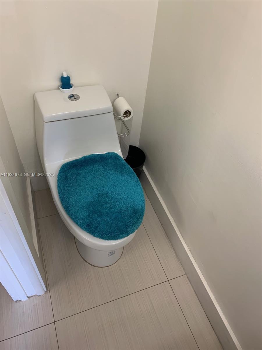 13215 Southwest 57th Terrace, Unit 206 Miami, FL 33183 - Photo 9 of 27 a bathroom with a sink and toilet