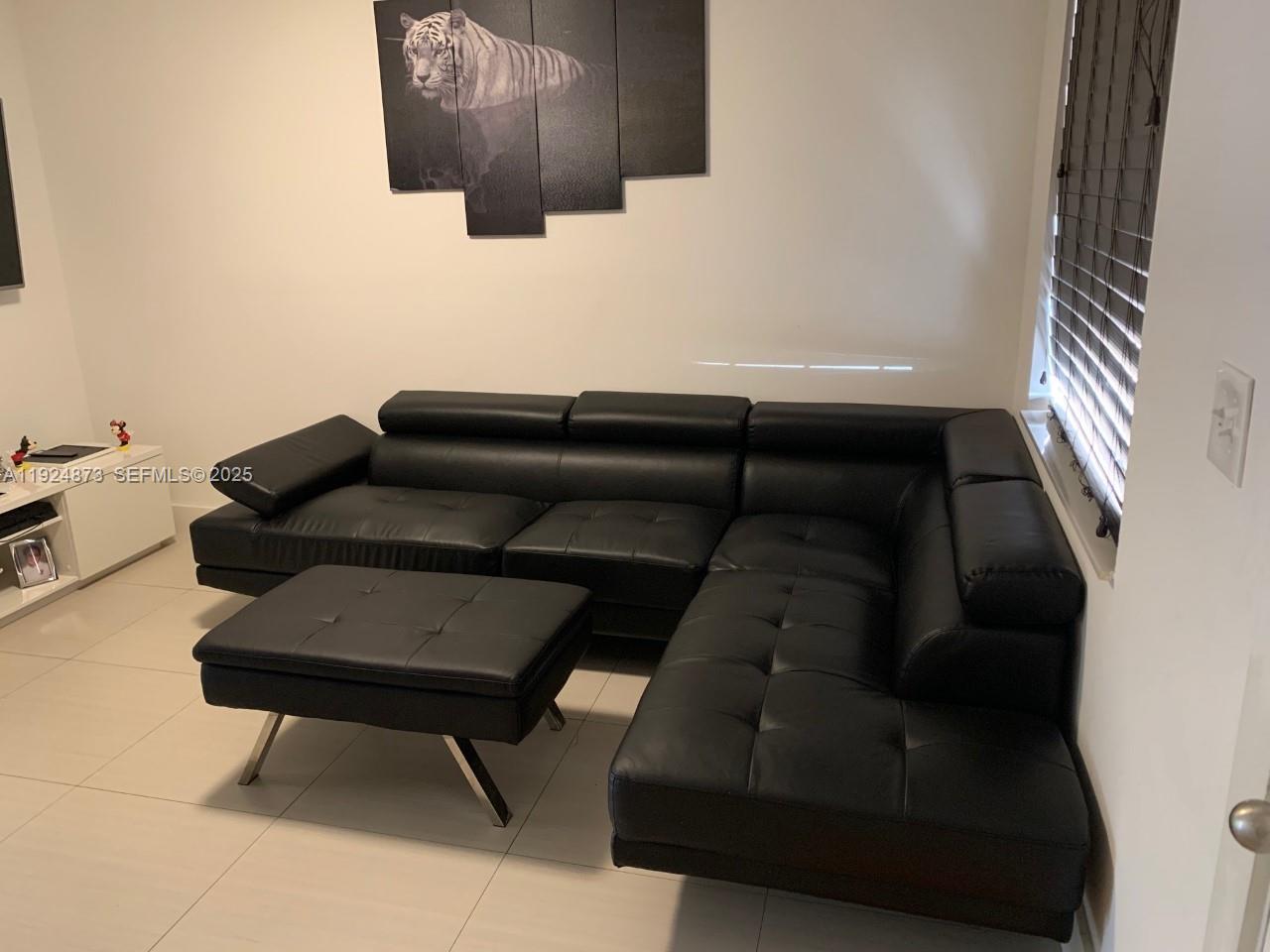 13215 Southwest 57th Terrace, Unit 206 Miami, FL 33183 - Photo 10 of 27 a living room with furniture and a couch