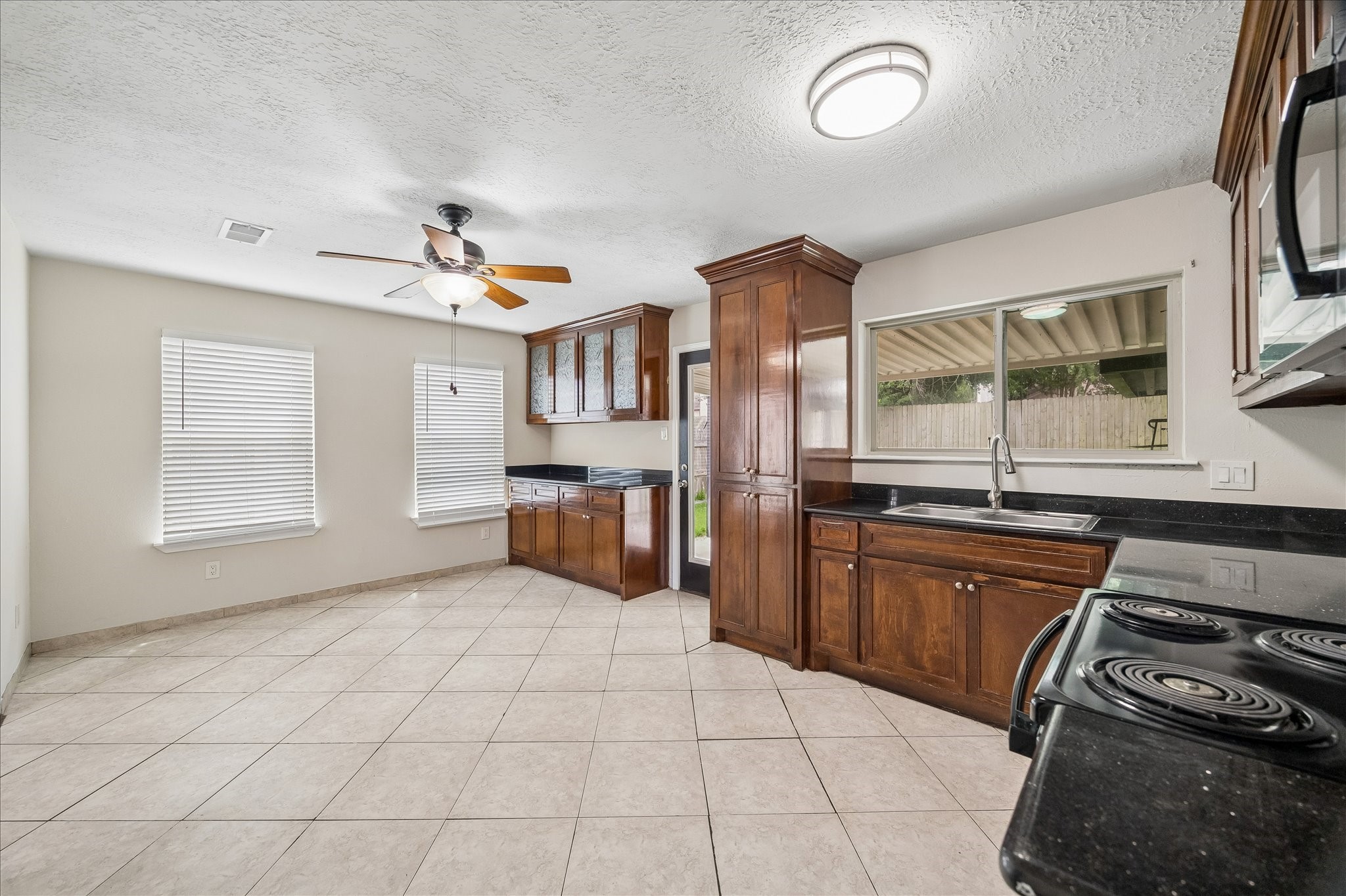 10411 Goodrum Road Houston, TX 77041 - Photo 11 of 25 Dining area just off of the kitchen with natural light and a door to the backyard area