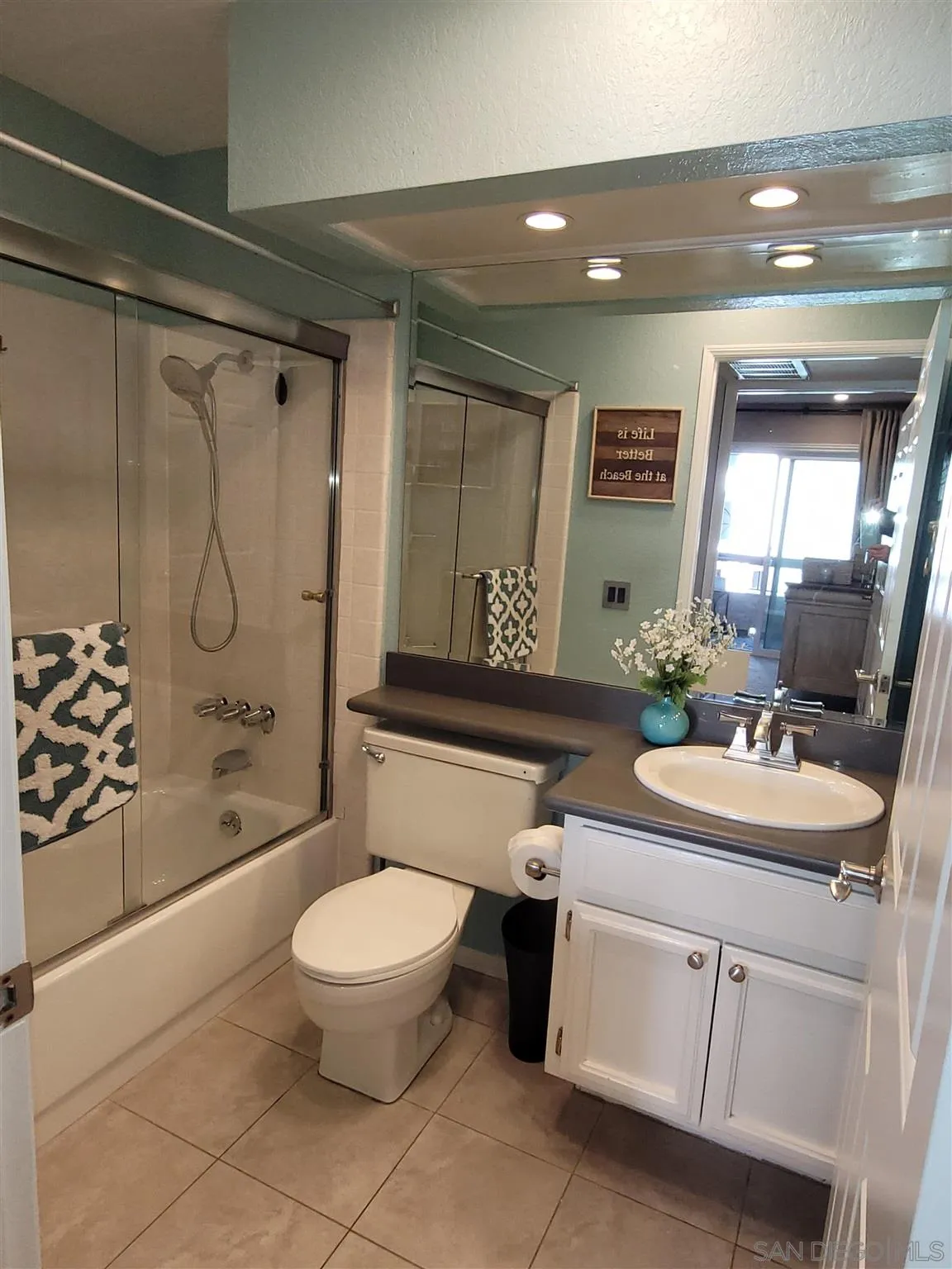 5605 Friars Road, Unit 285 San Diego, CA 92110 - Photo 11 of 11 a bathroom with a sink a toilet and shower