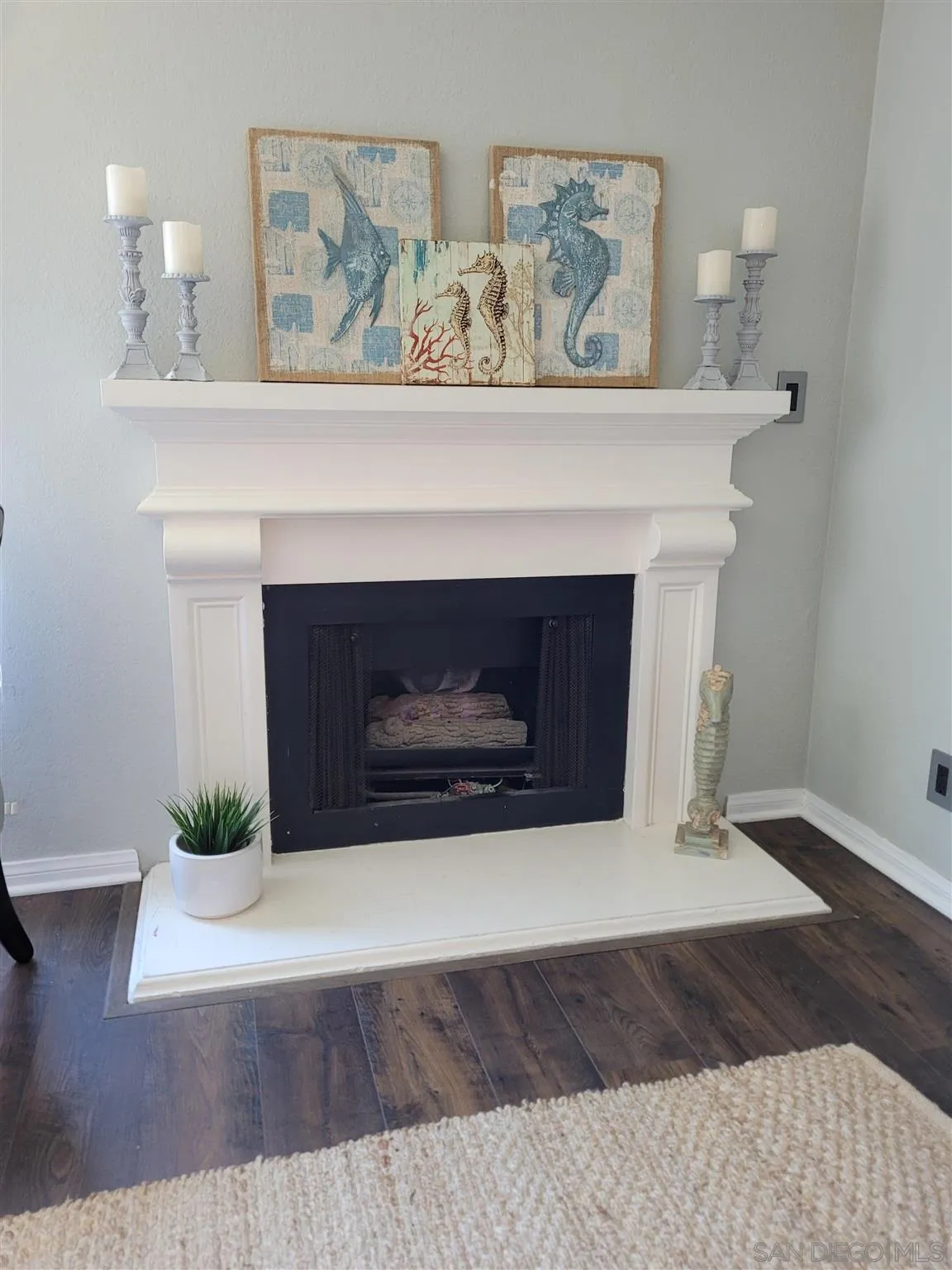 5605 Friars Road, Unit 285 San Diego, CA 92110 - Photo 4 of 11 a living room with a fireplace