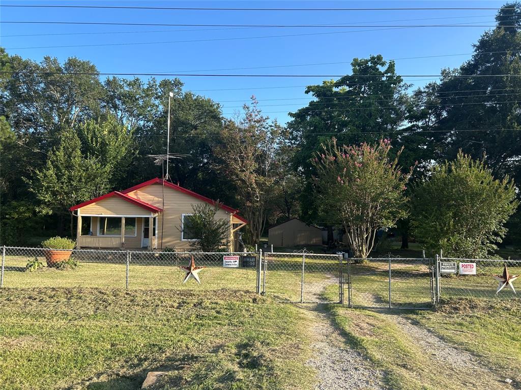a swimming pool with outdoor seating and yard