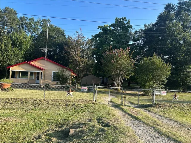 a view of a swimming pool with a bench