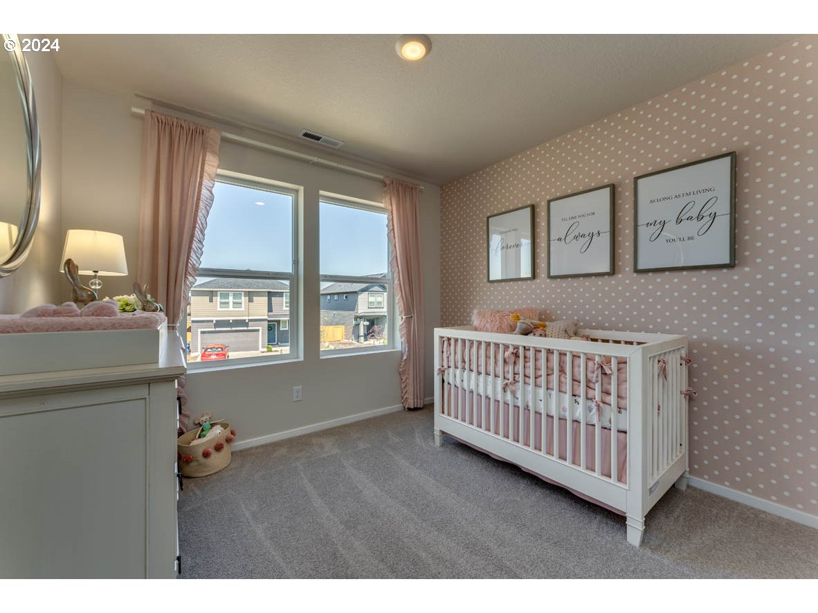 2993 V Street Springfield, OR 97477 - Photo 16 of 24 a bedroom with furniture and a window