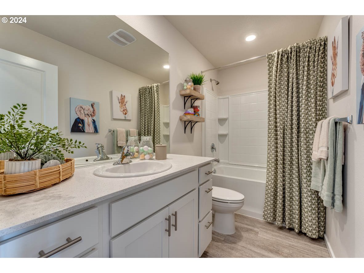 2993 V Street Springfield, OR 97477 - Photo 17 of 24 a bathroom with a sink a toilet and shower