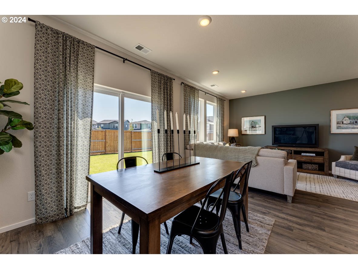 2993 V Street Springfield, OR 97477 - Photo 7 of 24 a view of a dining room with furniture and wooden floor