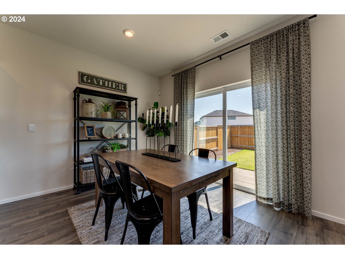 2993 V Street Springfield, OR 97477 - Photo 9 of 24 a view of a dining room with furniture and window