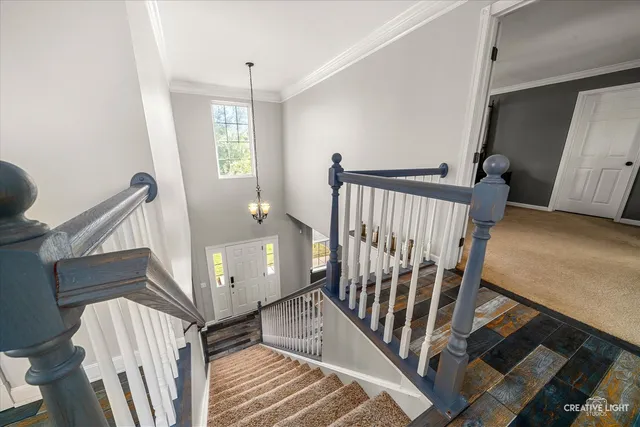 a bedroom with a bed and a flat tv screen on dresser