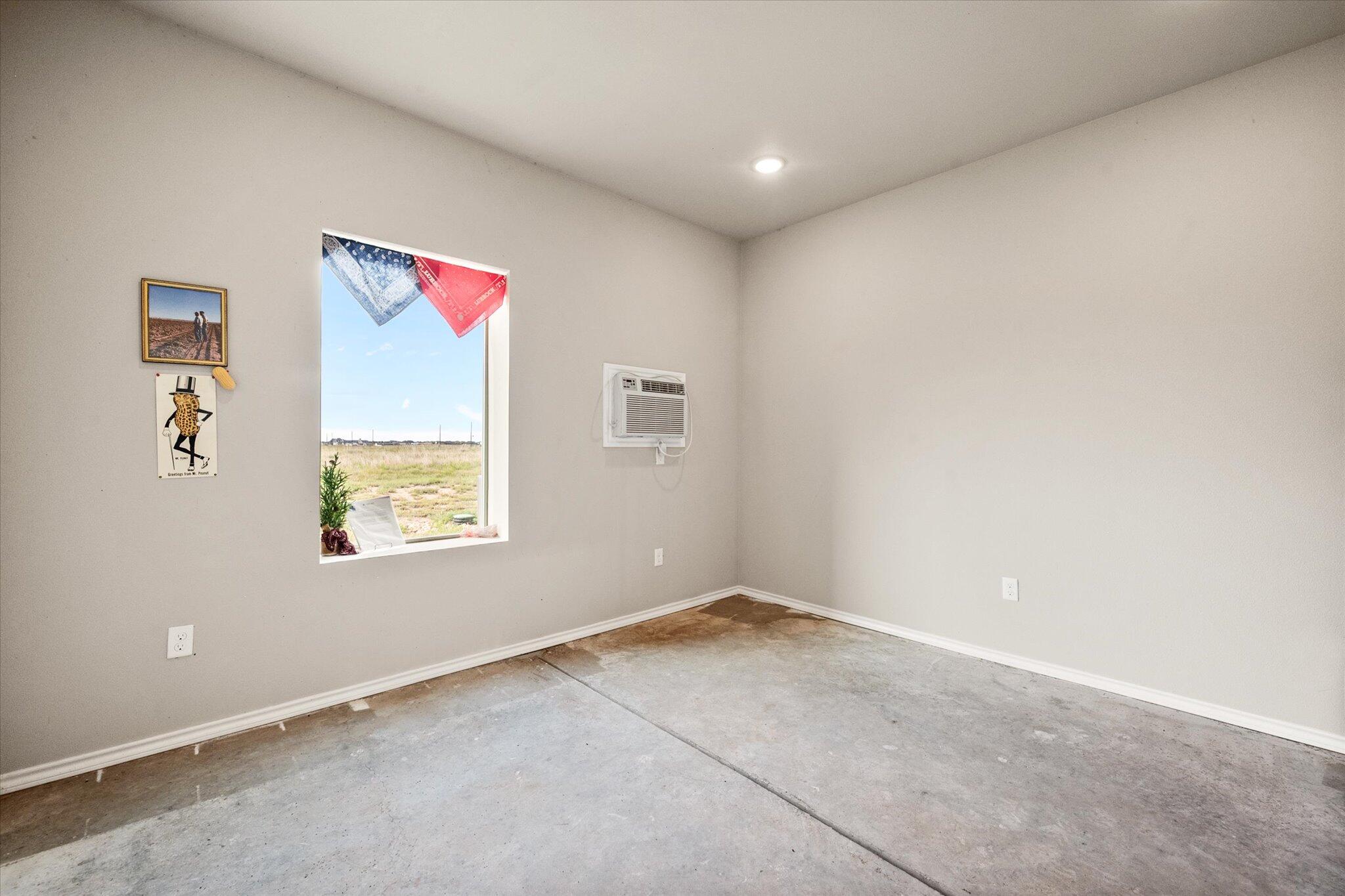 767 North Sandhill Road Tahoka, TX 79373 - Photo 8 of 27 a view of an empty room and a window