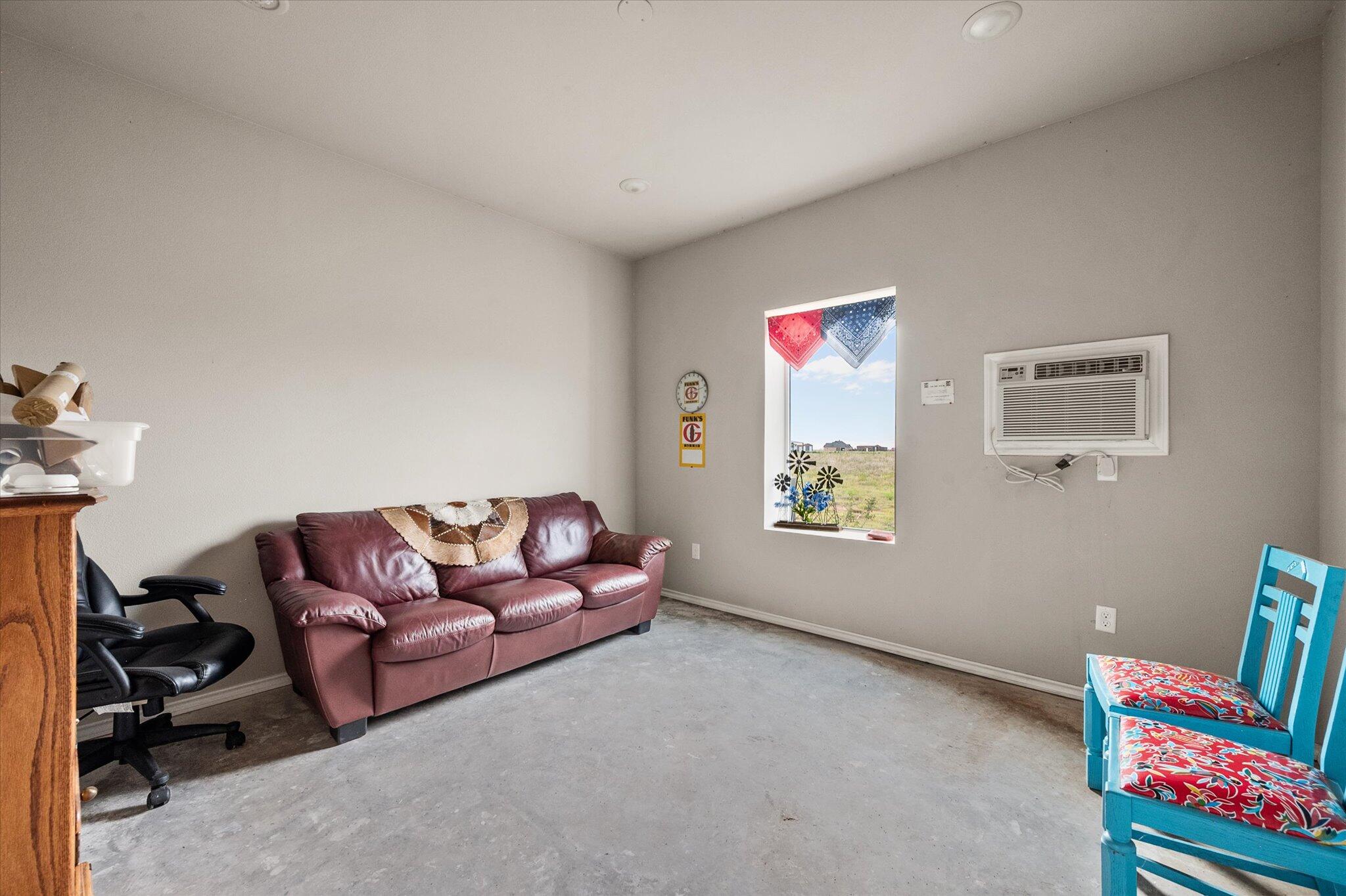 767 North Sandhill Road Tahoka, TX 79373 - Photo 10 of 27 a living room with furniture and a window